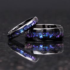 ►Material: Tungsten Carbide and Crushed Sandstone Inlay ►Color: Black Tungsten and Nebula Inspired Inlay ►Comfort Fit ►His Band Width: 8mm ►Her Band Width: 4mm ►Fit is true to size for His and Her bands ►This ring is inspired by the beautiful Orion nebula shown above. The color shifting blue-purple stones resemble gases of the nebula amongst a sea of stars. A beautiful alternative for a wedding band, this ring will stand out amongst the crowd of standard wedding bands. ►Sandstone is known for be Orion Nebula, Purple Wedding Rings, Couples Rings, Cute Engagement Rings, Tungsten Wedding Band, Black Wedding Rings, Couple Ring, Magical Jewelry, Black Ring