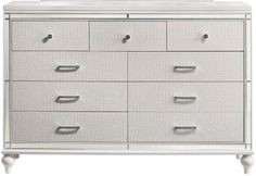 a white dresser with drawers and a mirror on it's top shelf, against a white background