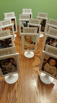 there are many pictures on the table with numbers and frames in front of each other