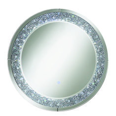 a round mirror with silver sparkles on the edges and sides, in front of a white background