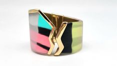 "Lucite Cuff Bracelet, Colorful Bangle Bracelet, Stained Glass Bracelet, Asymmetrical Bracelet, Graffiti Jewelry, Punk Cuff, Alexis Bittar Measurements: Fits up to 7.25\"L wrist. Width at widest point is 2\"W, at smallest point 1.5\"W Metal: Gold Tone Findings: Hinged Finish: Polished Excellent Condition You know that expression 'Party in the front, business in the back?' Yeah, this isn't that. This GORGEOUSLY UNIQUE piece from world famous jewelry designer Alexis Bittar is 100% PARTY ALL THE WAY AROUND! With a color scheme inspired by the wonderful 1980s this bright, colorful and happy piece will have you smiling all day long! Colors of Lucite include blue, pink, pale yellow, white and black, all of which have a STUNNING metallic sheen painted over the top. The front of the cuff features Asymmetrical Bracelet, Graffiti Jewelry, Big Lollipops, Famous Jewelry Designers, Famous Jewelry, Colorful Bangles, Glam Jewelry, Edgy Jewelry, Lucite Jewelry