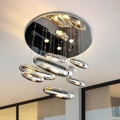 a modern chandelier hanging from the ceiling