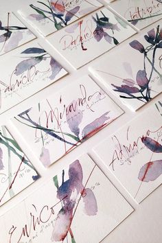 several business cards with watercolor flowers on them