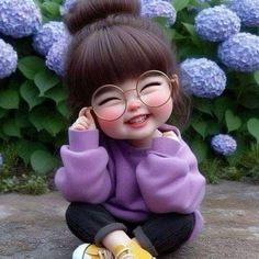 a doll with glasses sitting on the ground