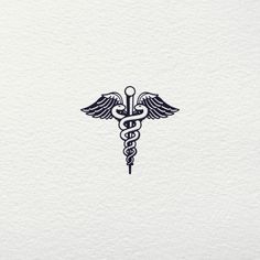 a medical symbol on white paper