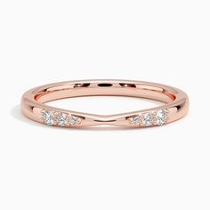 a rose gold wedding band with three diamonds