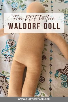 a stuffed doll laying on top of a bed with the words free pattern waldorf doll