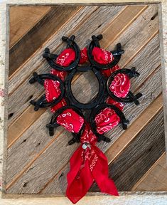 a red and black wreath with hearts on it