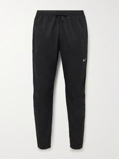 Nike Running's collection is designed to help you conquer your workout. , These 'Phenom Elite' track pants are made from moisture-wicking Dri-FIT , Mesh panels along the lower legs offer ventilation , Reflective details provide visibility in low-light conditions Nike Joggers Mens, Weekend Style, Pants For Men, Nike Running, Low Light, Sport Running, Mr Porter, Off Duty, Exclusive Collection