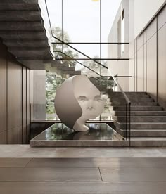 an artistic sculpture in the middle of a room with stairs leading up to it's entrance