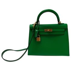 Hermes Bamboo Kelly 25 Bag. Excellent like new condition. Interior clean. Plastic is still on the hardware. Most wanted size Kelly. Rare small size. Includes clochette, lock, keys, and dust bag. Guaranteed authentic. Classic Green Satchel With Branded Hardware, Luxury Green Bag With Lock, Luxury Green Bags With Lock, Green Satchel With Palladium Hardware, Green Satchel With Palladium Hardware And Top Handle, Life Magazine Covers, Kelly 25, Chanel Flap Bag, Interior Clean