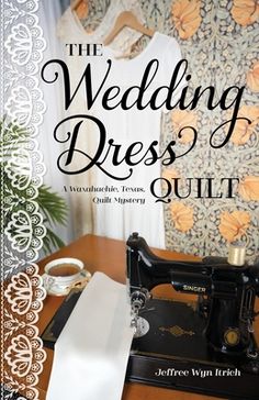 the wedding dress quilt book is sitting on a table next to an old sewing machine