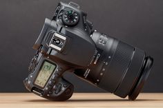 a digital camera sitting on top of a wooden table