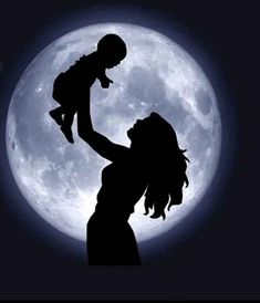 the silhouette of a woman holding a baby in front of a full moon with her arms outstretched