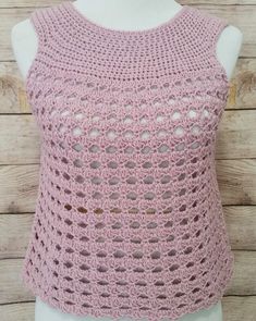 a pink crocheted top on a mannequin