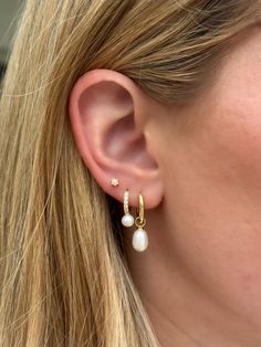 These pearl charm huggies are a show-stopper and super versatile - charm is removable so you can enjoy them as a simple hoop, too! Made of Sterling Silver 14K Gold or Rhodium plating Nickel-free & hypoallergenic Hoop diameter: 10mm Drop Length: 12mm Total Length: 27mm Sold as a pair Pearl Earring Stack, Grad Accessories, Dainty Ear Piercings, Stacked Pearl Earrings, Traditional Butterfly, Beachy Earrings, Hoco Nails, Earring Stack, Piercing Inspo