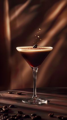 a martini glass filled with coffee beans and sprinkled with cinnamon on the rim