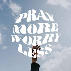 a person reaching up into the sky with their hand in the air and words that read pray more worry less