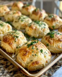 there are many rolls on the tray ready to be eaten