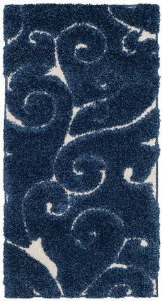 a blue rug with white swirls on it