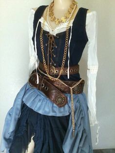 a mannequin wearing a skirt with chains on it's waist and belt