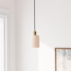 a lamp hanging from a ceiling in a room