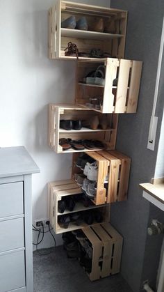 a room with some wooden shelves and shoes