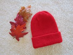 Stunning red beanie hat with brim! This is a double knit stitch and will definitely keep you toasty warm for winter. Made with 100% acrylic, so soft and no itch! Circumference 20" - 23".  Fits most adults and teens. Hand wash, lay flat to dry. Adjustable Handmade Red Beanie, Red Winter Beanie, Red Beanie Hat, One Size Fits Most, Casual Red Soft Knit Beanie, Red Beanie Hat, Men's Beanie, Red Beanie, Red Hand-knitted Beanie Cap, Mens Beanie