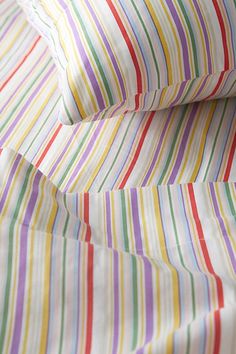 multicolored striped sheets folded on top of each other