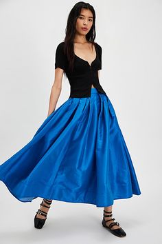 A true party staple, this special stunning skirt will turn heads with every wear. **Fit:** High-rise, full A-line silhouette **Features:** Sheen finish, pleating at top, finished hem, invisible zip closure, poplin fabrication **Why We ❤ It:** An essential piece to dress up or down, pair this with a silky cami or chunky sweater for endless ways to wear. | Emilia Full Skirt by Free People in Blue, Size: M Pleated A-line Maxi Skirt For Evening, Evening A-line Skirt With Pleated Waist, Evening Pleated A-line Skirt, Evening A-line Pleated Skirt With Lining, Evening A-line Skirt With Accordion Pleats, Evening A-line Dress With Relaxed Skirt, A-line Pleated Maxi Skirt For Party, Chic A-line Skirt For Party, Fitted A-line Maxi Skirt With Gathered Detail