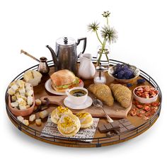 a wooden tray topped with lots of food