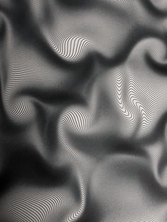 black and white photograph of wavy lines in the fabric material that is made from silk