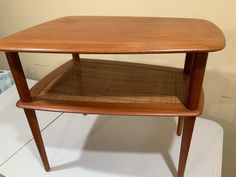 a wooden table sitting on top of a white counter