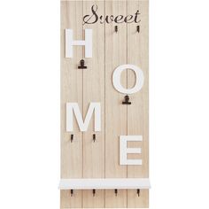 a wooden sign that says sweet home with hooks on the front and back of it