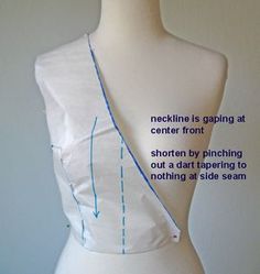 a white mannequin with blue lines on it's back and the words neckline is gaping at center front