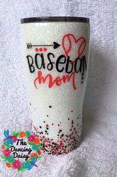 a white tumbler with the words baseball mom painted on it