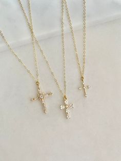 Stunning Pave Cubic Zirconia cross necklaces.  Take your pick. Gorgeous gift necklace, baptism or dedication gift.  Beautiful bridal necklaces too.   - Pendants - CZ + 14k gold plated brass - tarnish resistant - Chain + components - 14K Gold-filled  - Lobster Clasp - 14K Gold-filled   Cross #1 - 20mm x 27mm Cross #2 - 11mm x 16mm Cross #3 - 11mm x 14mm Listing is for one cross.  Choose from the pulldown menu. . . . . . . . . . . . . . . . . . . . . . . . . . . . . . . . . . .  Necklace arrives p Elegant Cross Pendant For Confirmation, Elegant Confirmation Cross Pendant Jewelry, Delicate Cross Jewelry For Wedding, Personalized Cross Jewelry For Confirmation, Wedding Cubic Zirconia Cross Necklace, Gold Cross Pendant Jewelry For Confirmation, Gold Cross Jewelry For Confirmation, Dainty Cross Pendant Jewelry For First Communion, Delicate Cross Necklaces For Weddings