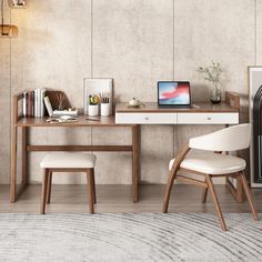 a room with a desk, chair and laptop computer on the table next to it