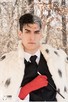 a man in a fur coat and red gloves