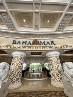 the entrance to an upscale hotel with statues on either side and a sign that reads,'baha mar '