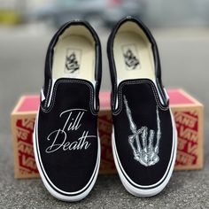 Till Death customized Black/White Vans Slip Ons with the rocker hand.These Vans are perfect for a wedding gift for a bride and groom. Custom Made-to-Order shoes. Looking for these in white? Grab them here: https://bit.ly/48jAKLm We buy each pair of blank shoes BRAND NEW from the Vans retail store. The ink is permanent and will never come off. Made in the USA. This price includes everything: shoes, artwork, and shipping. Please message us with any questions!Sizes listed are in US sizing scale. If Black Wedding In The Woods, Matching Wedding Shoes Bride And Groom, Halloween Wedding Ideas Diy, Gothic Outdoor Wedding, Wedding Ideas Dark, Romantic Goth Wedding, Friday The 13th Wedding, Classy Halloween Wedding, Black Wedding Ideas