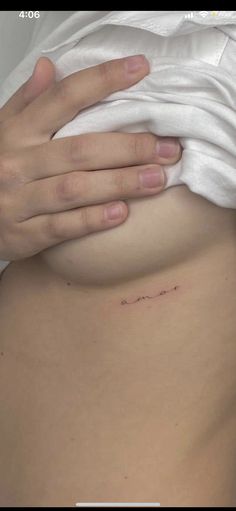 a woman's stomach with the word love written on it