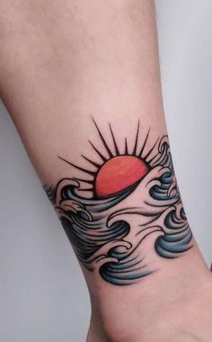 a sun and waves tattoo on the wrist is shown in this image, it looks like an ocean wave