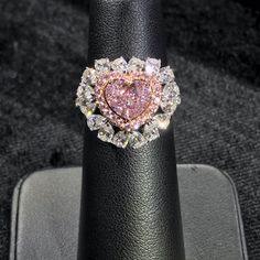 Approximately 1.00 Carat Heart Shape GIA Certified Faint Pink 3.00 Carat Total VVS1 Clarity Set in 18k White Gold Fancy Pink Diamond Halo 16 White Pear Shapes Order will be ready to ship in 3-4 weeks. Pink Heart Engagement Rings, Fancy Pink Diamond Ring, Pink Heart Rings, Heart Diamond Ring, Pear Shapes, Heart Shaped Diamond Ring, Pink Diamond Engagement Ring, Pink Diamond Ring, Heart Engagement Rings