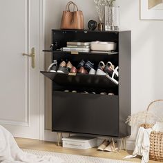 a shoe rack with shoes and purses on it next to a white door in a room