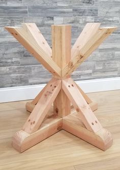 a wooden table sitting on top of a hard wood floor