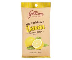 a bag of old fashioned lemon candies on a white background with a yellow stripe