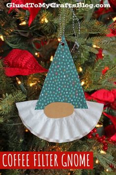 coffee filter gnome ornament hanging from a christmas tree