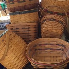 several woven baskets stacked on top of each other