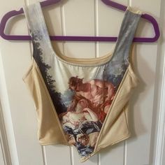 Super Cute Renaissance Style Art Corset Top. New Without Tags, New Condition As Pictured. Bought About A Year Ago And Never Ended Up Wearing It So Hoping It Can Go To A New Come. Has Academia Vibes, Would Also Be Cute For A Renfaire Or Even A Museum Trip! Fits Like A Small/ Xs Please Message Me With Any Questions! Offers Encouraged And Willing To Discount Bundles! Renaissance, Renaissance Art, Renaissance Faire, Renfaire, Ren Faire, Light Academia, Dark Academia, Corset, Corset Top, Academia Sty Art Corset Top, Dark Academia Corset, Art Corset, Cherub Art, Top Academia, Trip Fits, Top Paintings, Art Angel, Academia Style